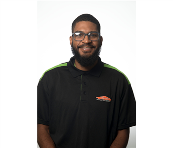 male, black servpro uniform top, glasses