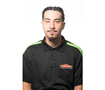 male, black servpro shirt, small goateau